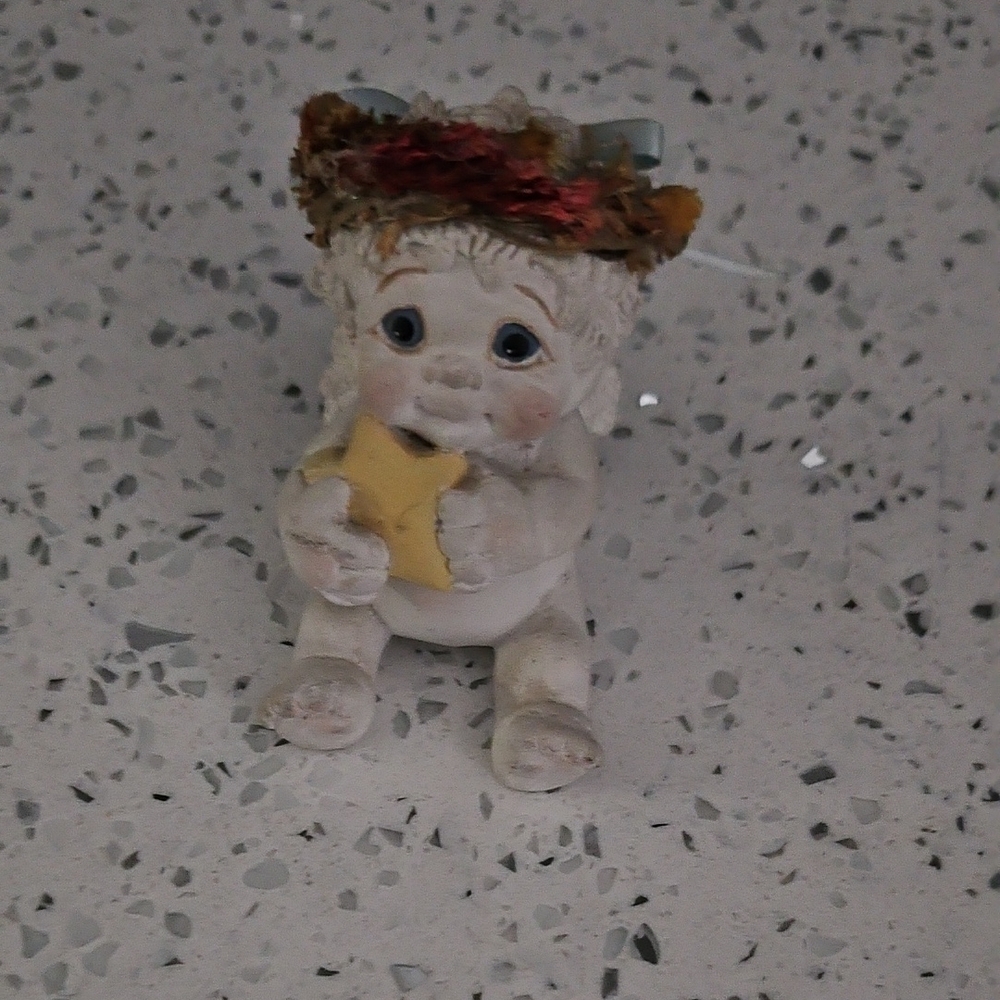 Adorable Cherub Figurine with Star